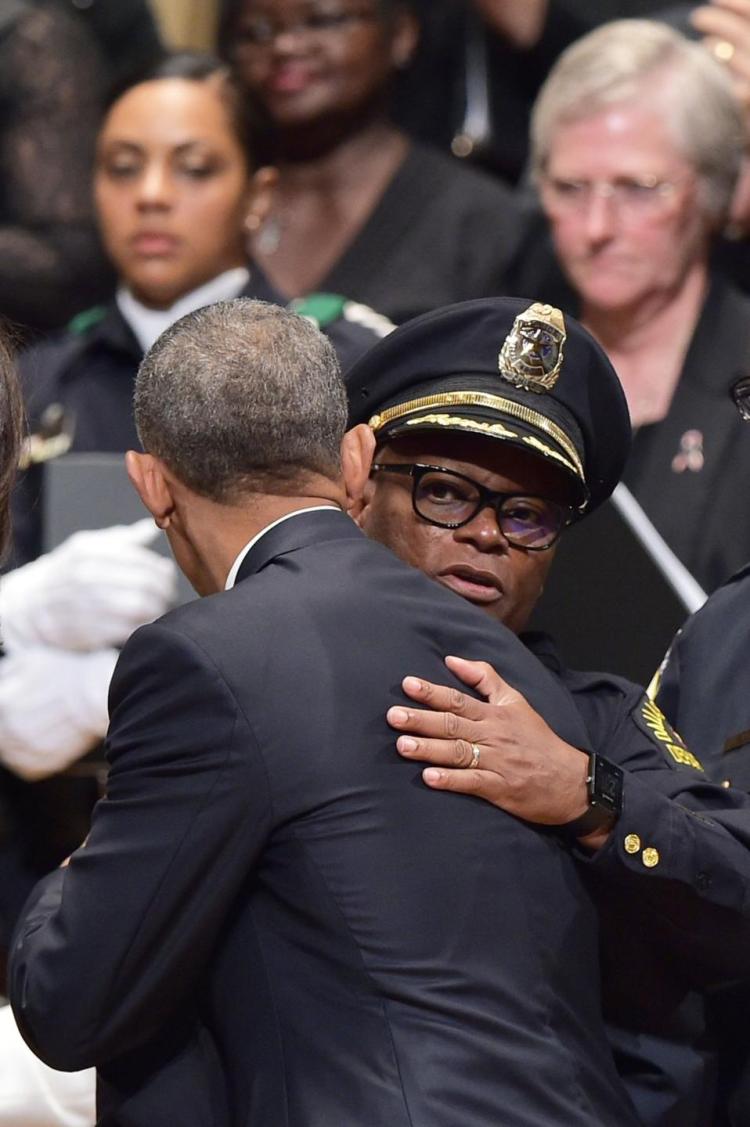 Obama hugs Dallas Police Chief David Brown.