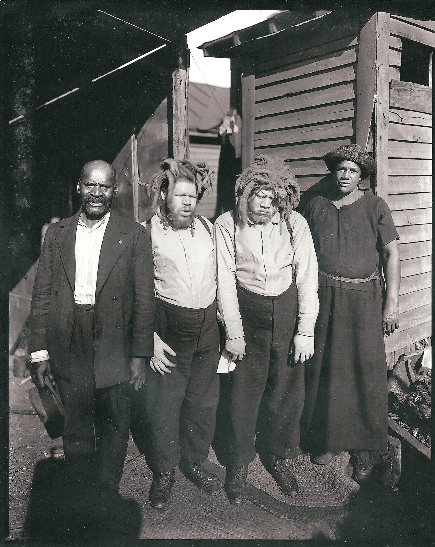 Harriett Muse, right, and husband Cabell, far left, with the brothers shortly after she found them at a sideshow in 1927. Photograph by George Davis, courtesy of Frank Ewald 